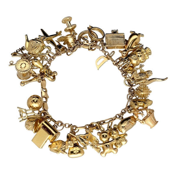 9ct Yellow Gold  Ladies Charm Bracelet 32 Charms - 49.4 grams.