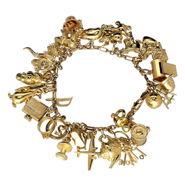 9ct Yellow Gold  Ladies Charm Bracelet 32 Charms - 49.4 grams.