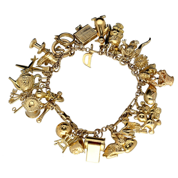 9ct Yellow Gold  Ladies Charm Bracelet 32 Charms - 49.4 grams.
