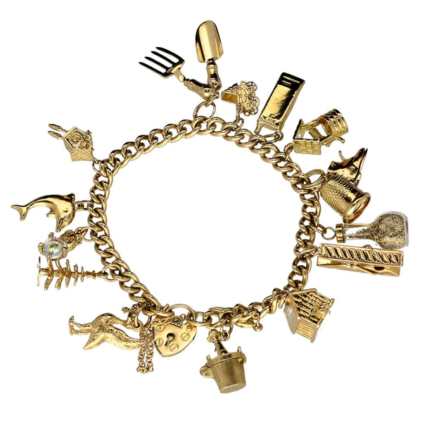 9ct Yellow Gold  Ladies Charm Bracelet 16 Charms - 43.60 grams.