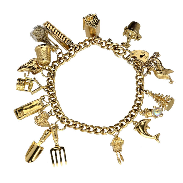 9ct Yellow Gold  Ladies Charm Bracelet 16 Charms - 43.60 grams.
