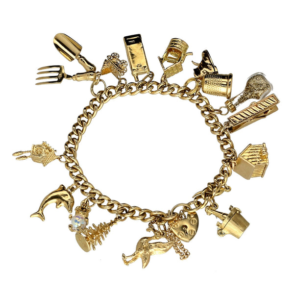 9ct Yellow Gold  Ladies Charm Bracelet 16 Charms - 43.60 grams.