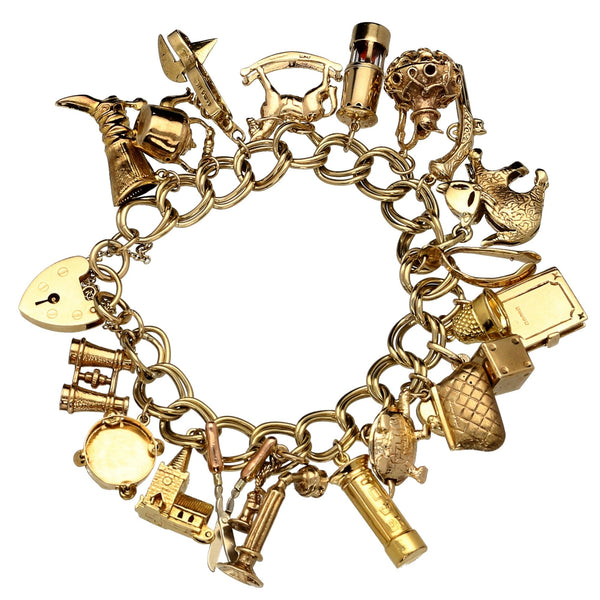 9ct Yellow Gold  Ladies Charm Bracelet 21 Charms - 64.40 grams.