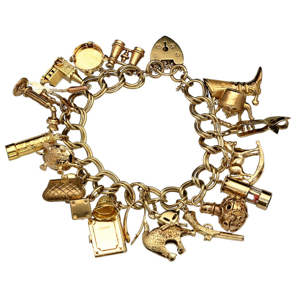 9ct Yellow Gold  Ladies Charm Bracelet 21 Charms - 64.40 grams.