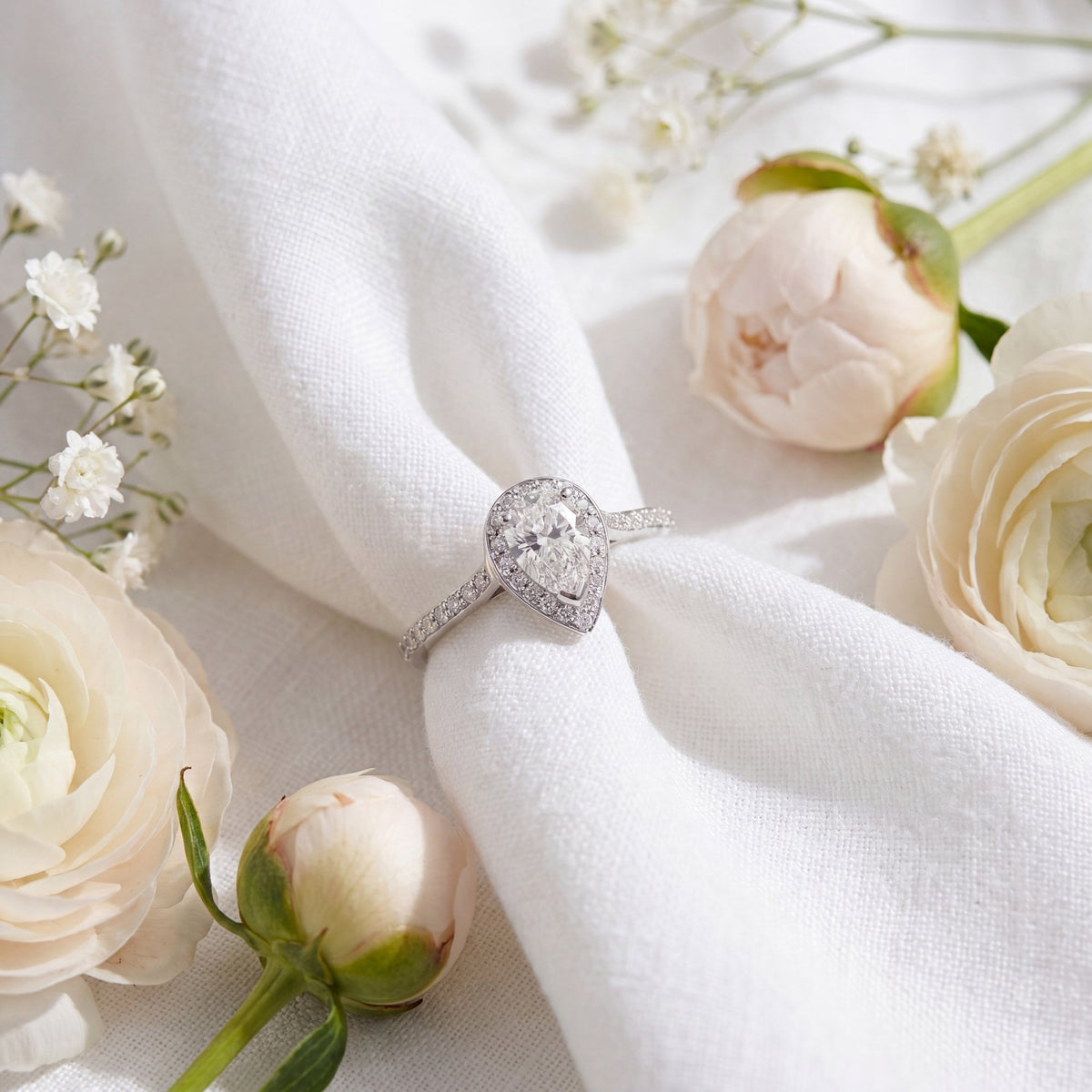 950 Platinum Pear Diamond Halo Engagement Ring - Size H½ -0.70ct